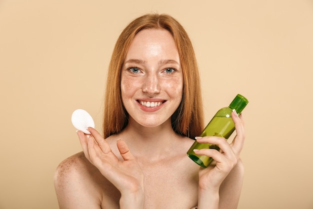 Beauty portrait of a healthy young topless redhead girl