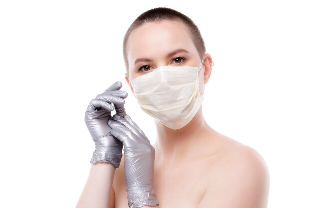 Beauty portrait of a shorthaired woman in mask and gloves