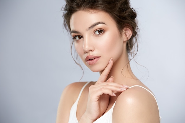 Beauty portrait of woman with shiny make-up and glossy lips