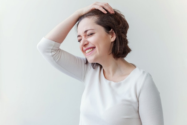 Beauty portrait young happy positive brunette woman on white background isolated