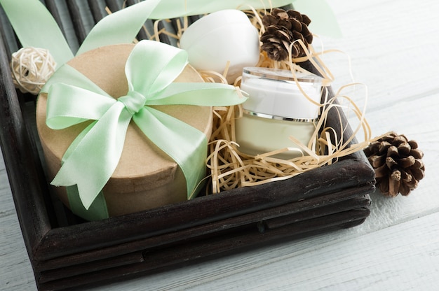 Beauty products, gift with green ribbon