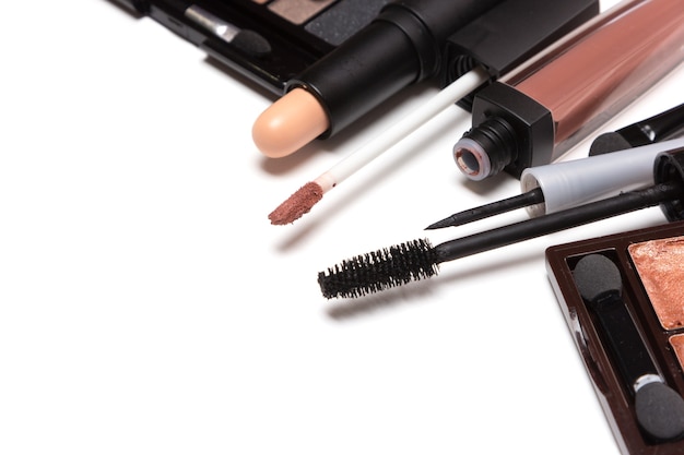 Beauty products for natural day makeup on white with copy space. Close-up, selective focus