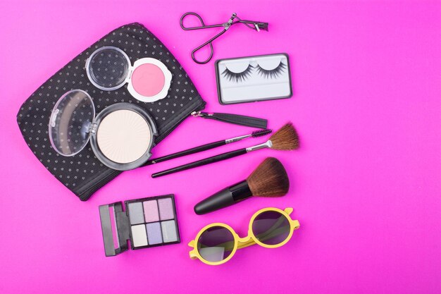 Beauty products over pink background