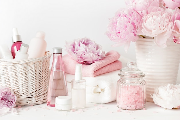 Beauty products with peony flowers