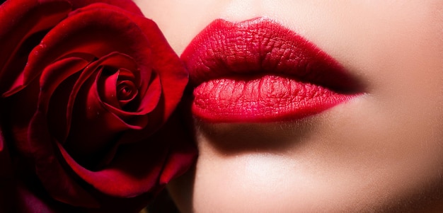 Beauty red lips makeup detail beautiful woman lips with rose