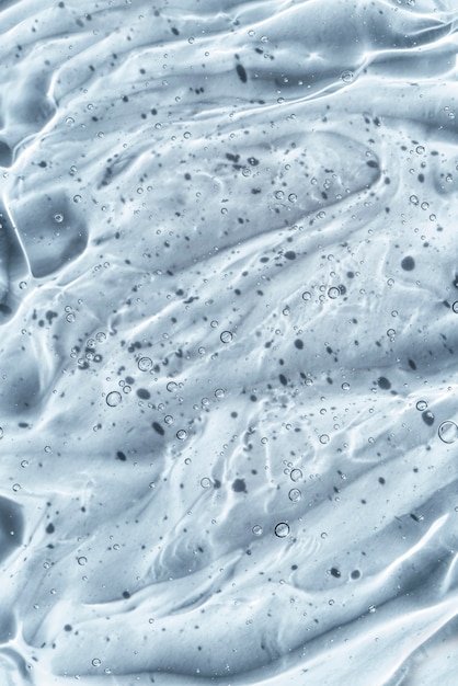 Foto siero di bellezza texture gel crema per la cura della pelle chiara con sfondo di bolle