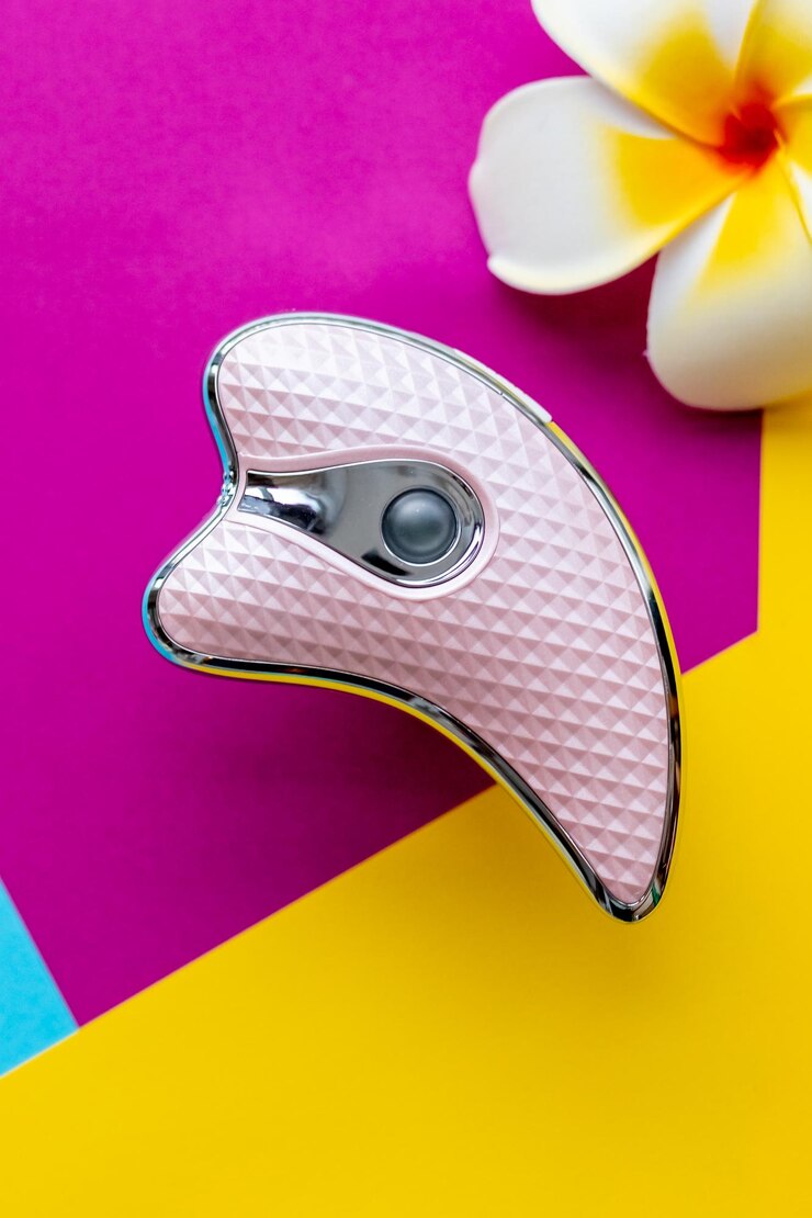 Photo beauty serum and microcurrent toning device on color background skin care anti age and lifting procedures top viewultrasonic skin scrubberface massager home skin care led beauty