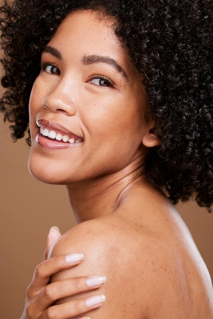 Beauty skincare and face portrait of black woman with self care wellness natural cosmetics and luxury facial makeup Dermatology healthcare and aesthetic African model isolated on brown background