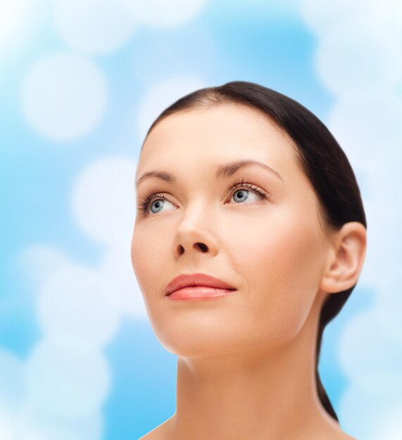 beauty, spa and health concept - relaxed young woman