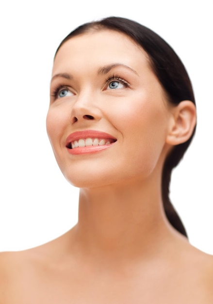 beauty, spa and health concept - smiling young woman