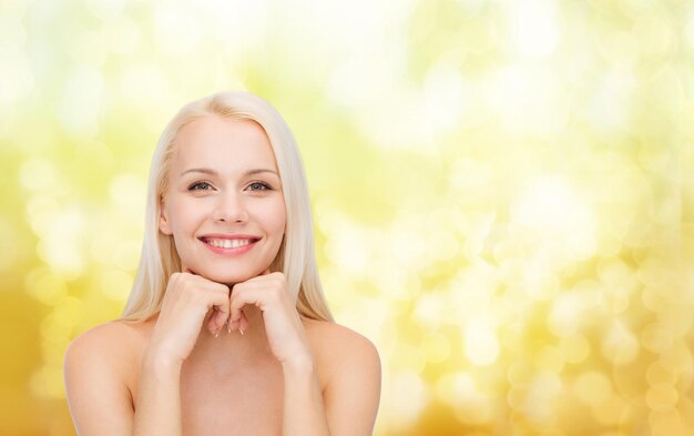 beauty, spa and health concept - smiling young woman