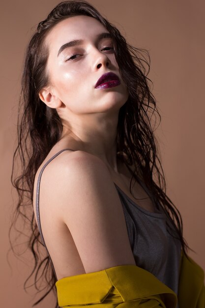 Beauty studio portrait of an attractive caucasian brunette woman.