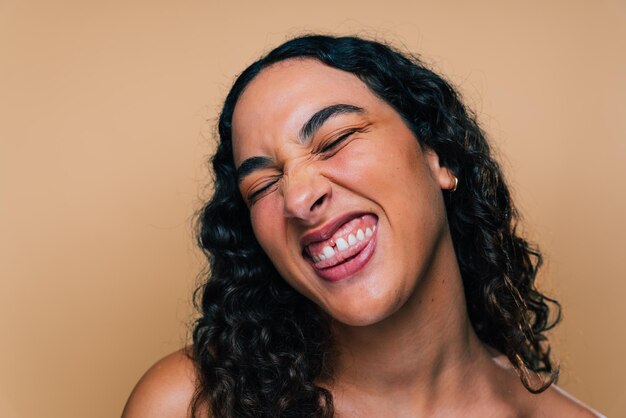 Beauty studio portrait of beautiful hispanic woman with diastema