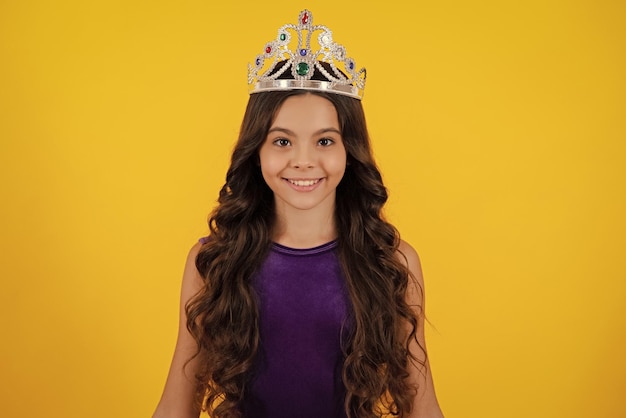Beauty teen girl queen wear crown Child in princess diadem Happy girl face positive and smiling emotions