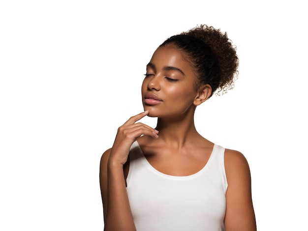 Beauty woman black skin face smiling model touching her face. Isolated on white.