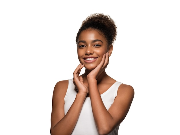 Beauty woman black skin face smiling model touching her face. Isolated on white.