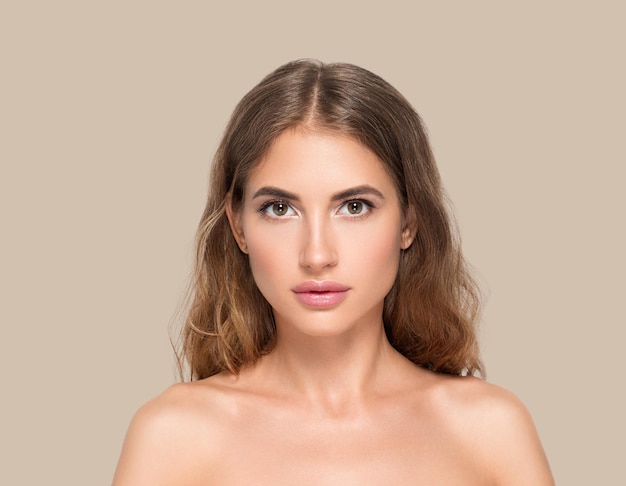 Beauty woman face healthy beautiful skin close up female portrait on color background. Brown