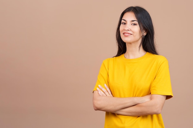 Beauty woman standing whit arms crossed smiling at the camera