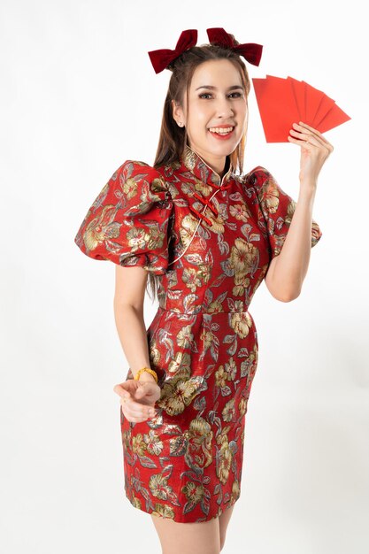 Beauty woman wear cheongsam and take red envelopes in chinese new year