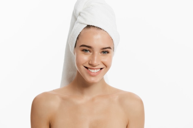 beauty woman wearing hair towel after beauty treatment. 