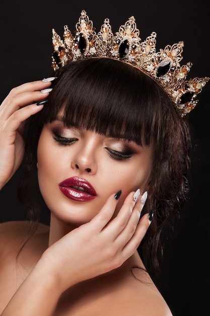 Beauty woman with beautiful make-up color, crown on his head  .