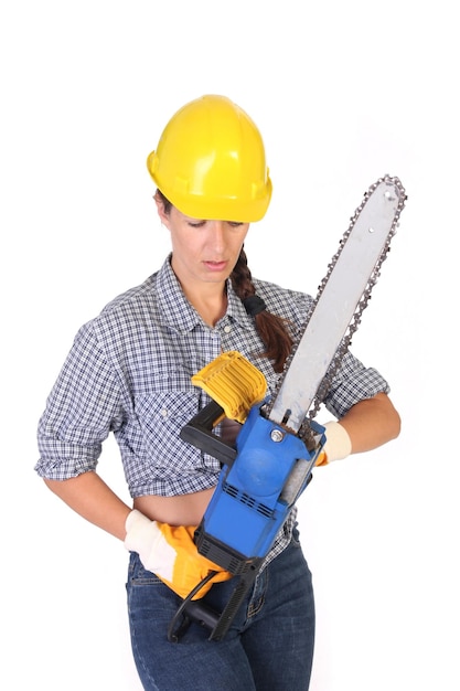 Beauty woman with chainsaw