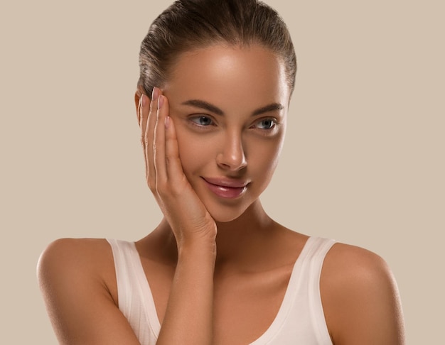 Beauty woman with hands healthy  natural make up clean fresh skin  concept color background brown