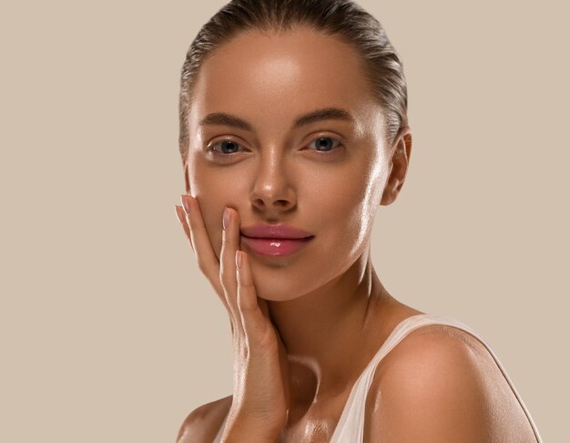 Beauty woman with hands healthy  natural make up clean fresh skin  concept color background brown