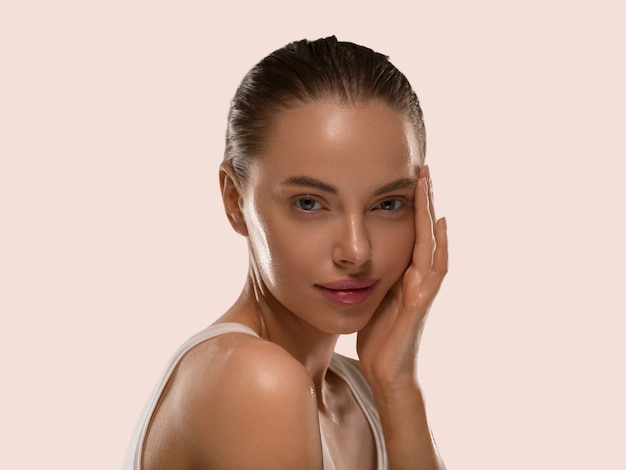 Photo beauty woman with hands healthy  natural make up clean fresh skin concept color background yellow