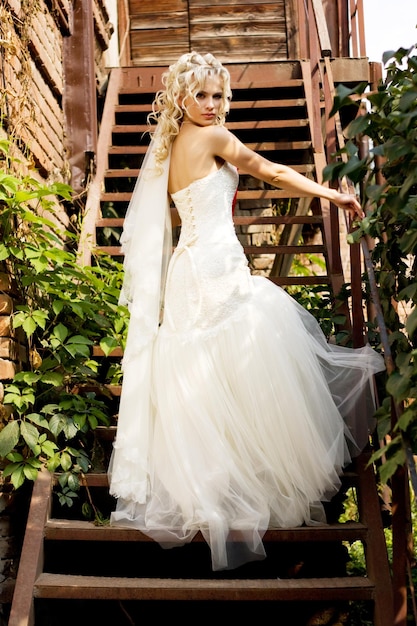 Beauty young blonde bride in amazing wedding dress