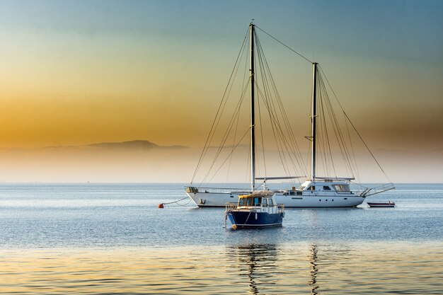 Beautyful Sunrise over the bay with yacht
