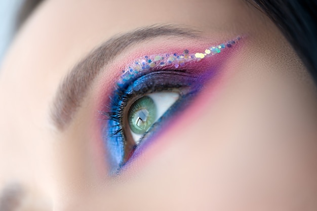 Beautyful woman with makeup closeup macro photo