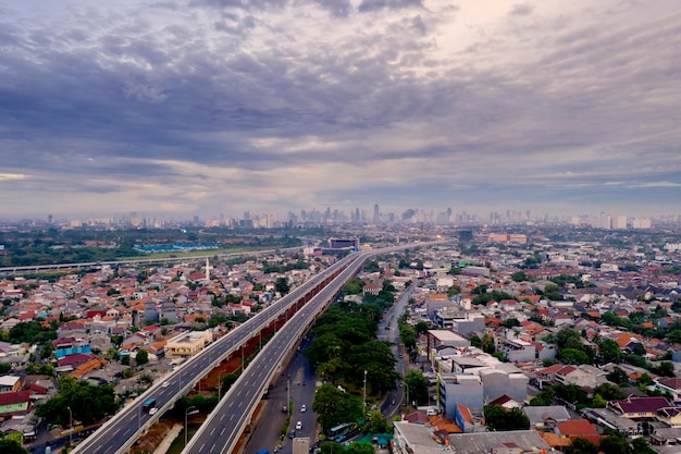 Becakayu toll road with dense houses in Jakarta