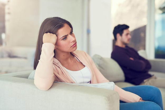 Photo becoming disconnected portrait of a young woman giving her husband the silent treatment after a fight