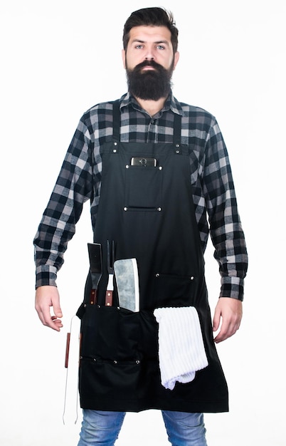 Photo becoming a professional chef barbecue master class at grill restaurant confident grill master in working uniform master chef wearing grill apron with barbecue tools master of grill