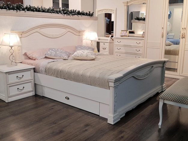 Photo bed in the bedroom in a classic style