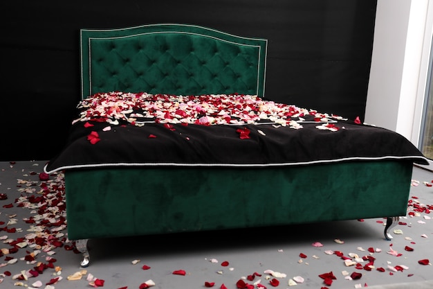 Bed covered with rose petals, acquaintance, Valentine's Day, furniture salon, healthy sleep.