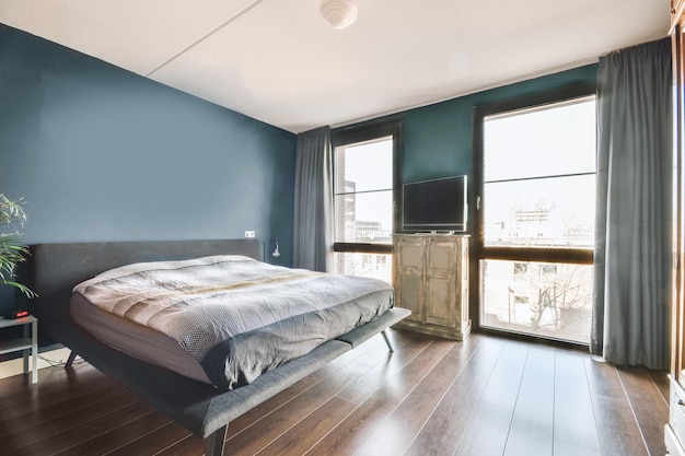 Bed near window in modern apartment