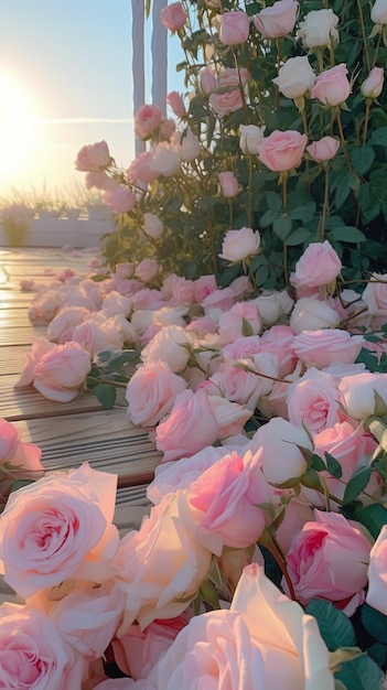 A bed of pink roses on a wooden deck