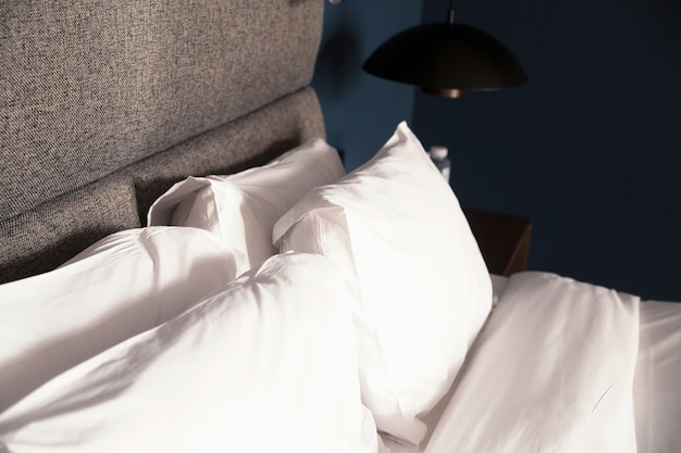 Bed with a pillow,table, lamp