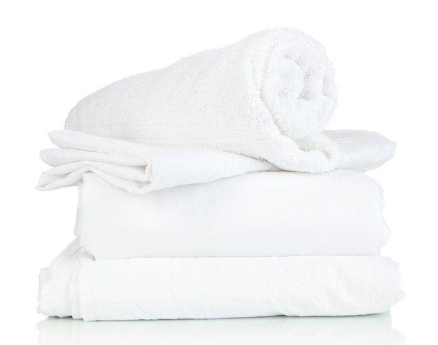 bedding sheets and towels isolated on white