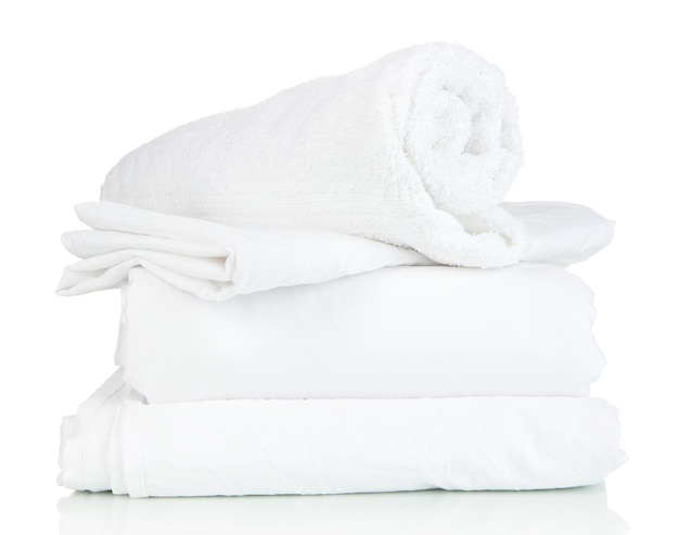 Bedding sheets and towels isolated on white