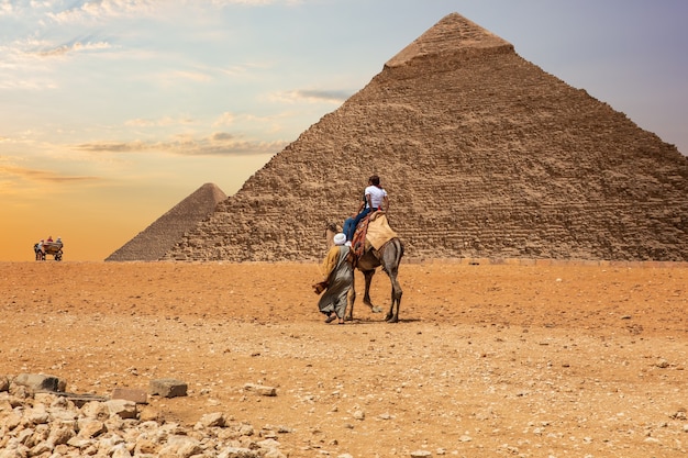 Bedouins in Giza desert near the Great Pyramids of Egypt.