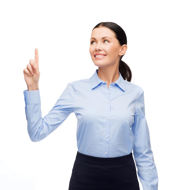 bedrijfs- en nieuwe technologieconcept - aantrekkelijke jonge vrouw met haar vinger omhoog
