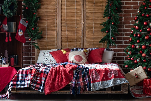 Bedroom interior in Christmas style, design of a cozy room in Christmas.