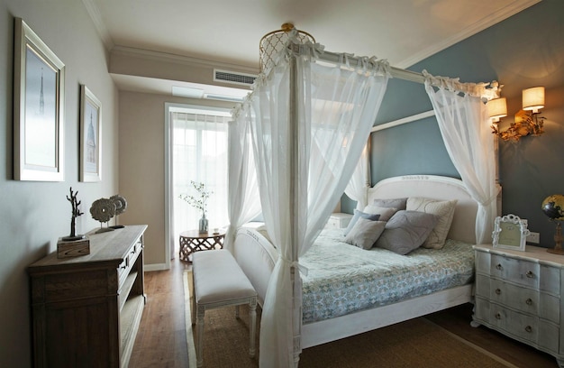 a bedroom with a bed and a window with a white curtain that says  duvet