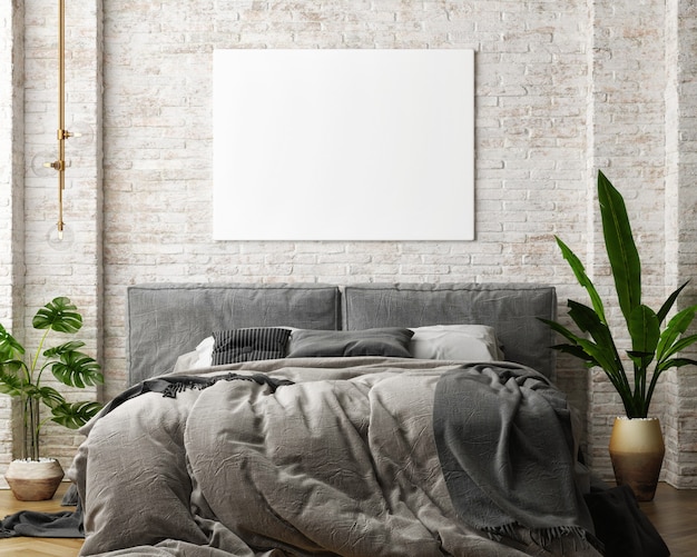 Bedroom with gray bed and mockup poster on the old brick wall