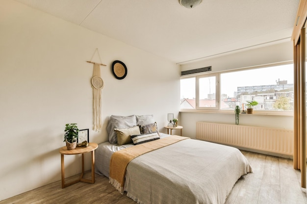 A bedroom with a large bed and a large window