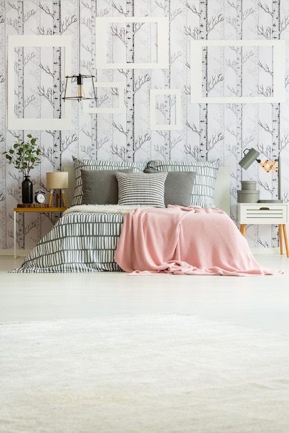 Photo bedroom with striped bedsheets