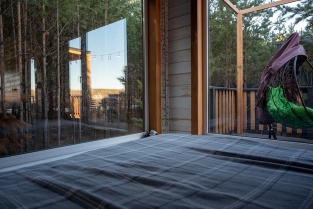 Bedroom with a view of the forest and sky